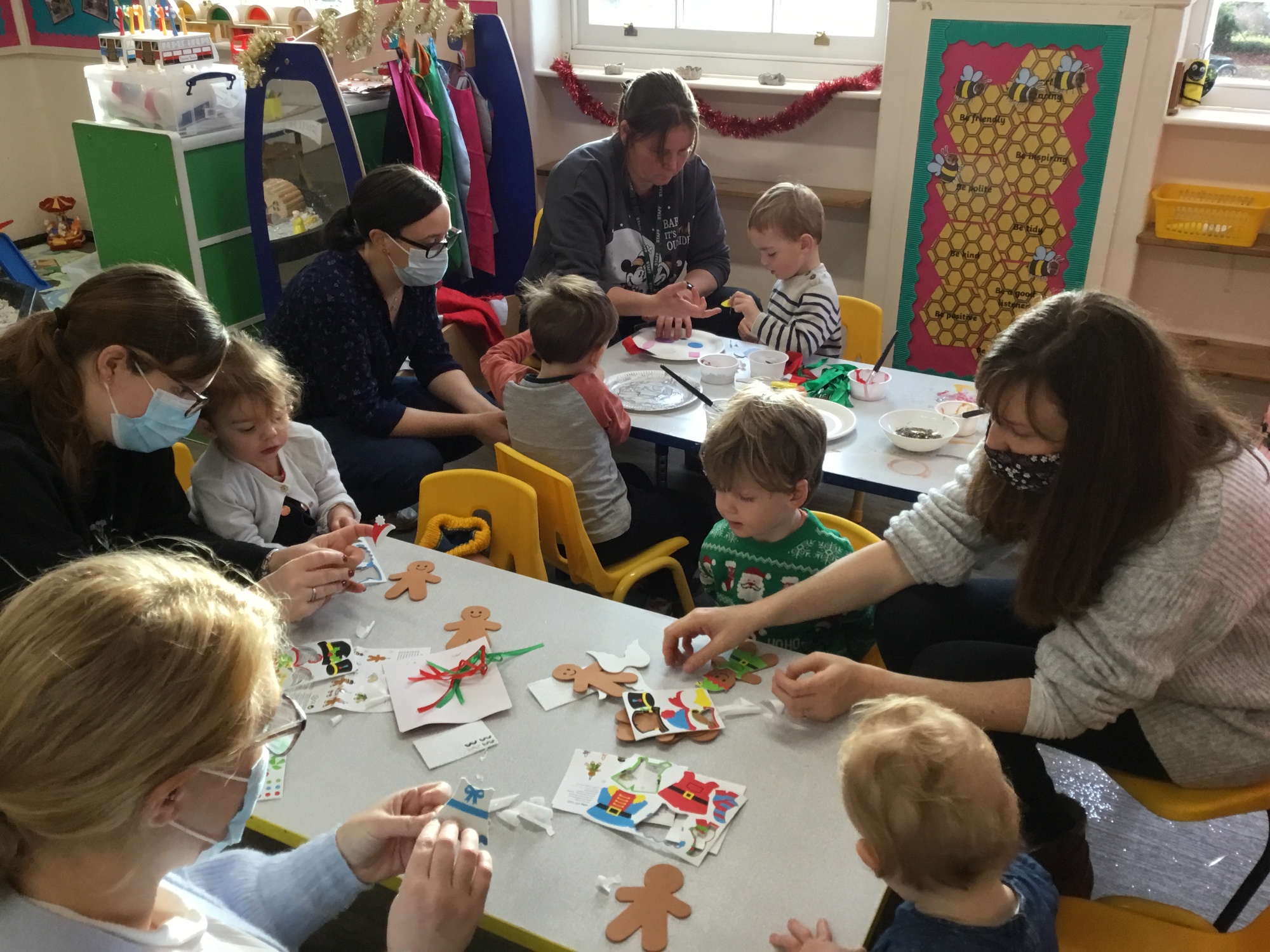 A group of children and parents taking part in craft activities