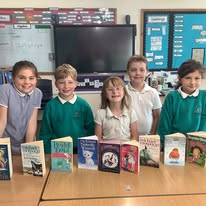 Click here for Class 2 Two children measuring a post in the school playground